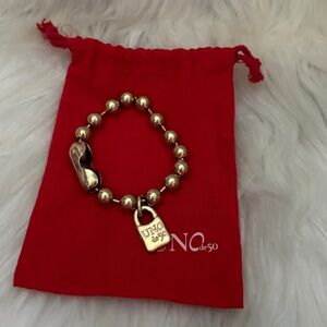UNO de 50 Gold Beaded Bracelet with Red Pouch
